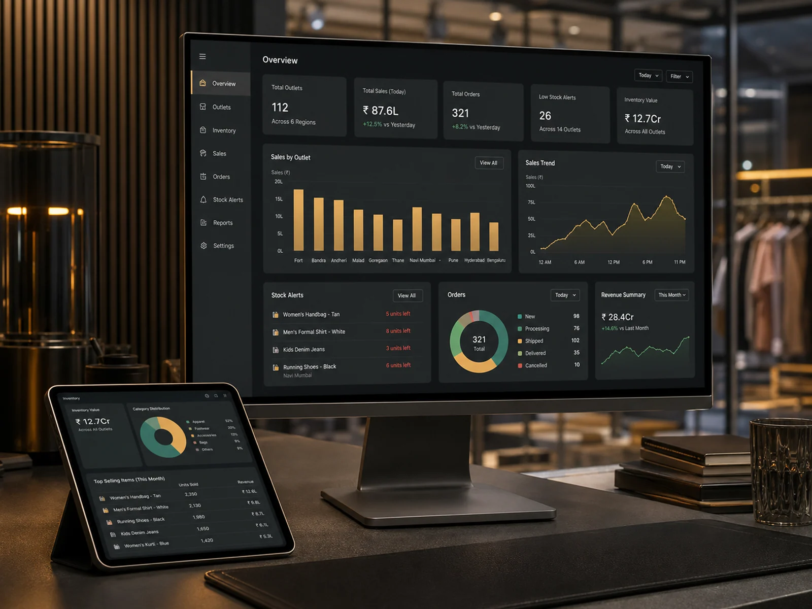 Premium retail chain dashboard showing outlet sales, inventory value, low stock alerts and order trends on monitor and tablet.