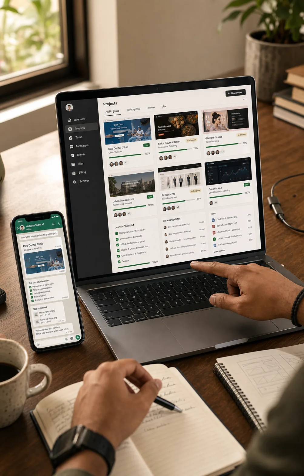 Realistic workspace showing active website project cards, launch checklist, and support updates on laptop and phone.